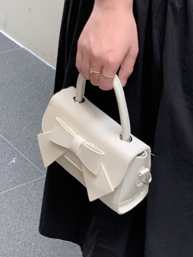 Bolso de mano pequeño cuadrado con lazo de color liso elegante para mujer