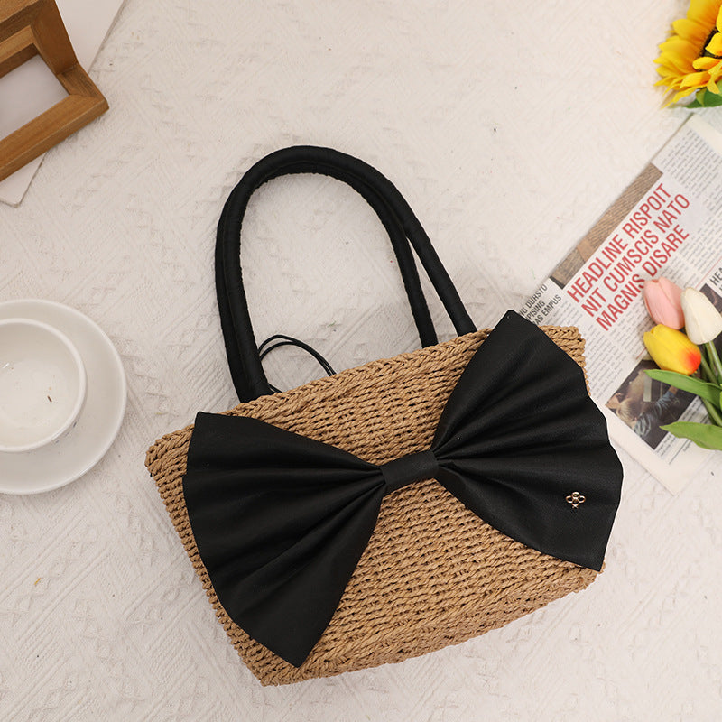 Bolso de mano tejido de paja con lazo bohemio