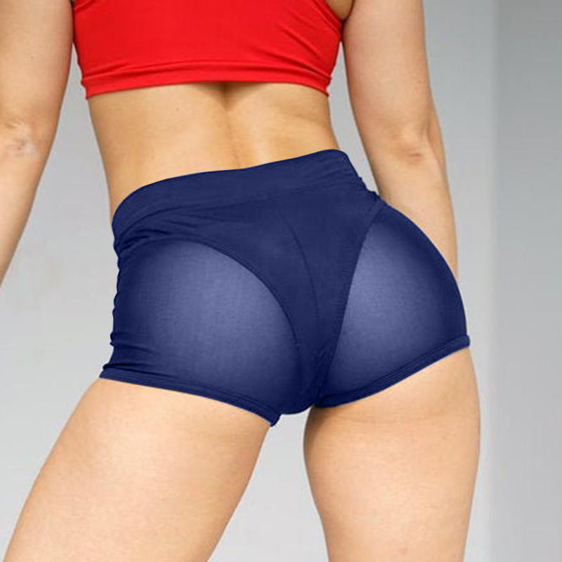 Pantalones cortos deportivos casuales de malla con costuras de color sólido para mujer