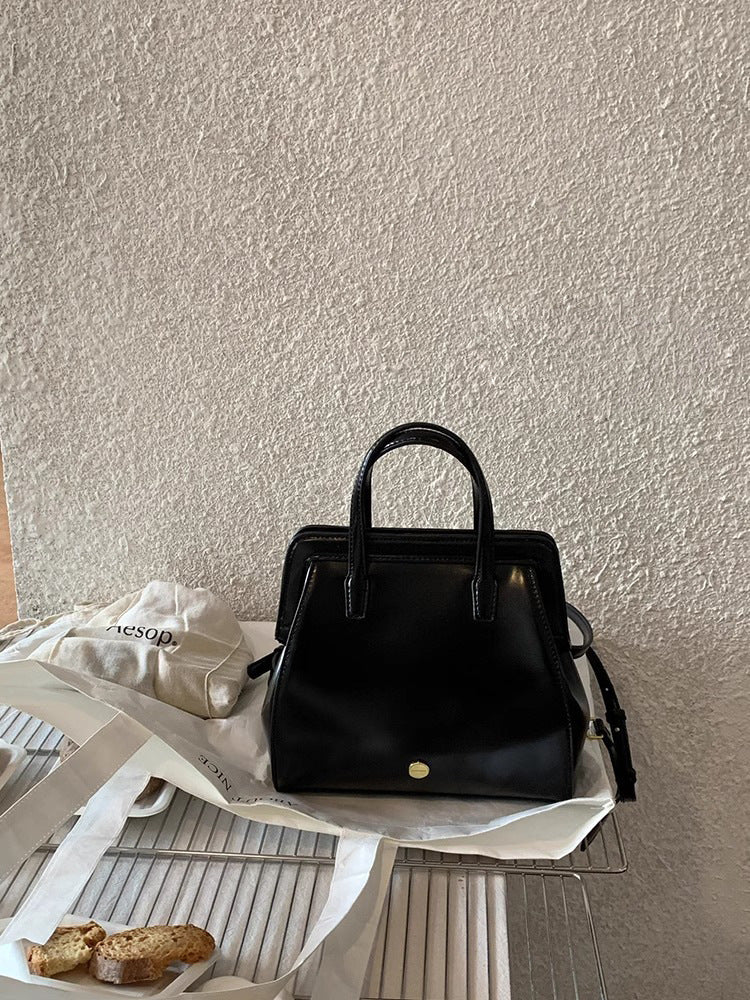 Bolso de mano retro informal de piel encerada negra para mujer