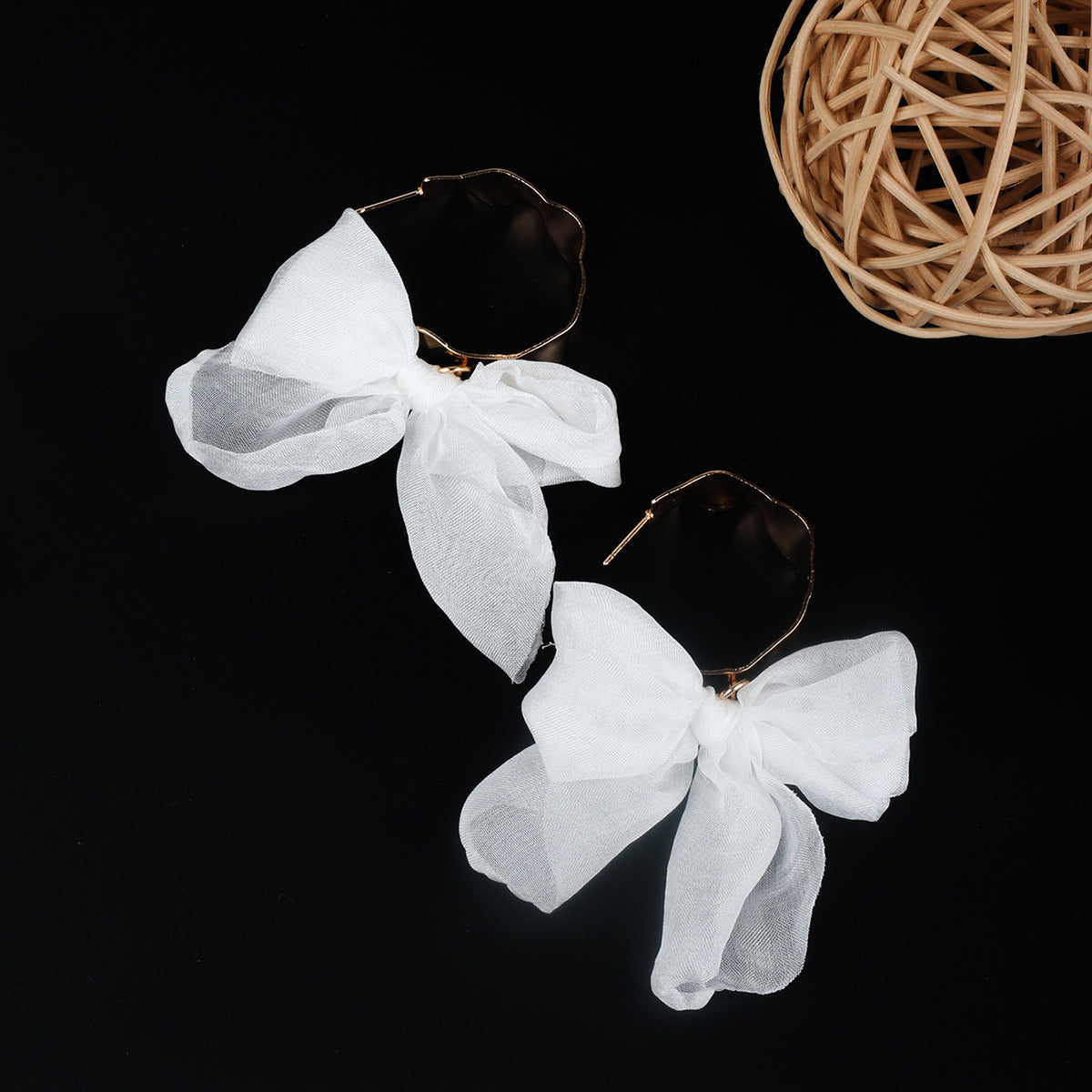 Boucles d'oreilles bohèmes en cuivre avec nœud pour les fêtes