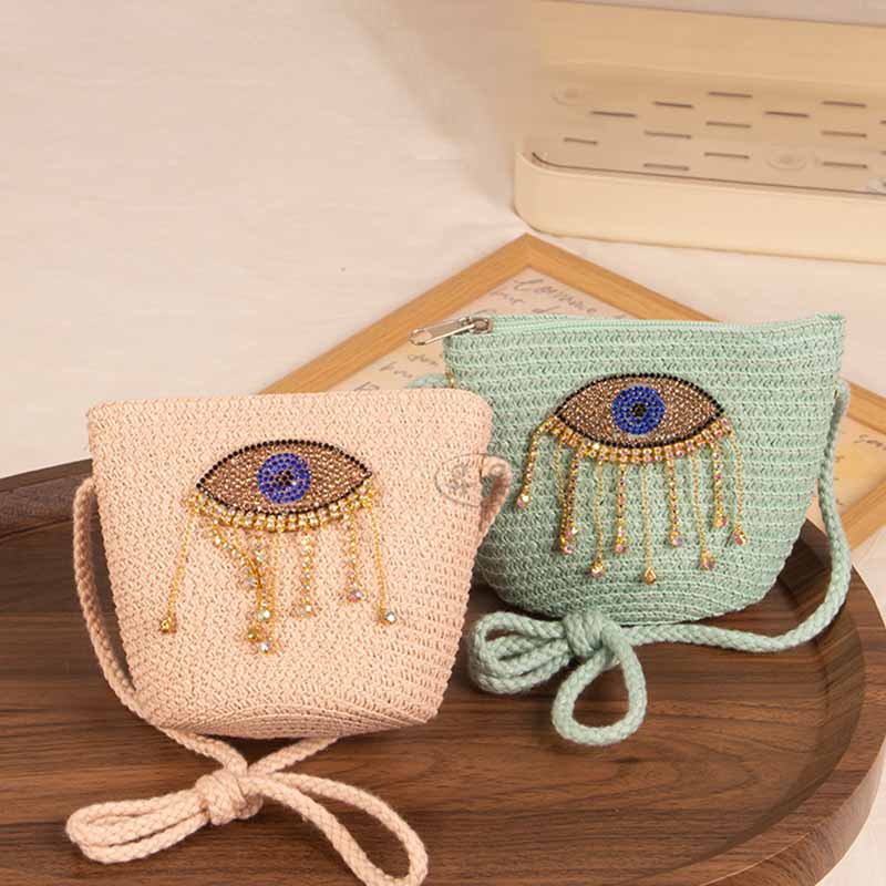 Bolso bandolera informal de paja con diseño de ojo malvado para niñas