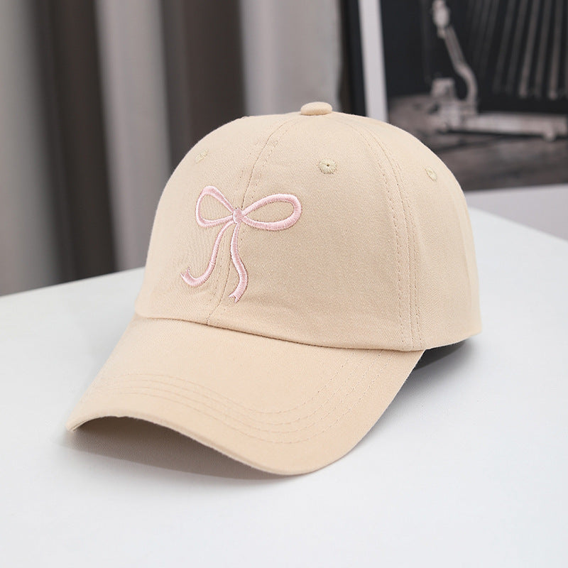 Gorra de béisbol con lazo bordado de color liso para mujer