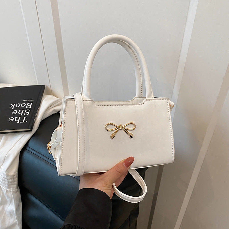 Bolso de mano informal de PU de color sólido con hebilla de lazo para mujer
