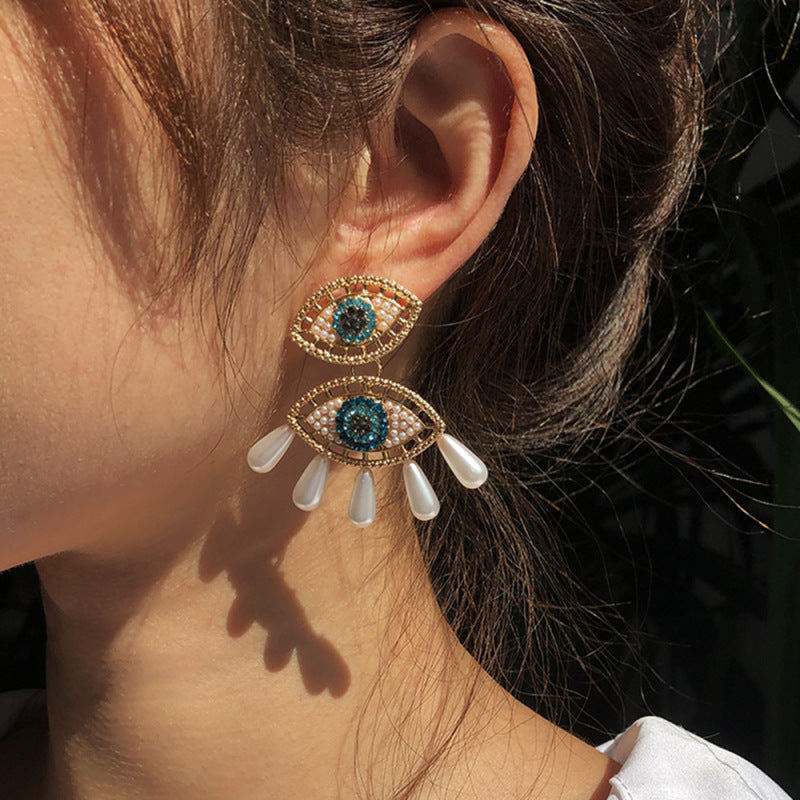 Pendientes de ojo de diablo con perlas de imitación de diamantes de imitación para mujer