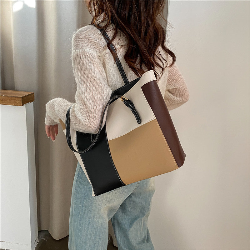 Bolso de mano de gran capacidad con costuras de moda en color