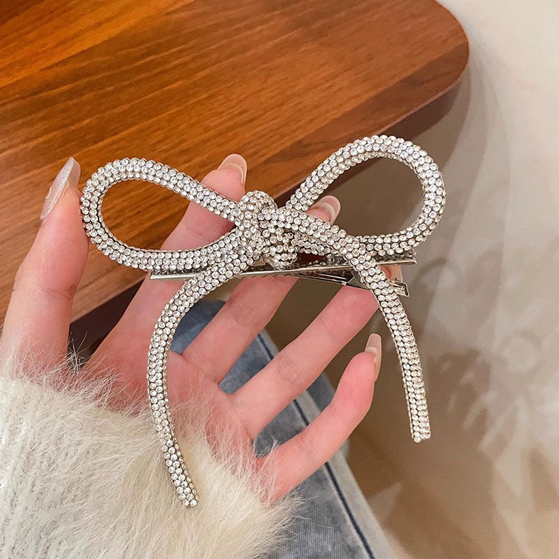 Horquilla con lazo de diamantes de imitación de color liso para mujer - Estilo aleación