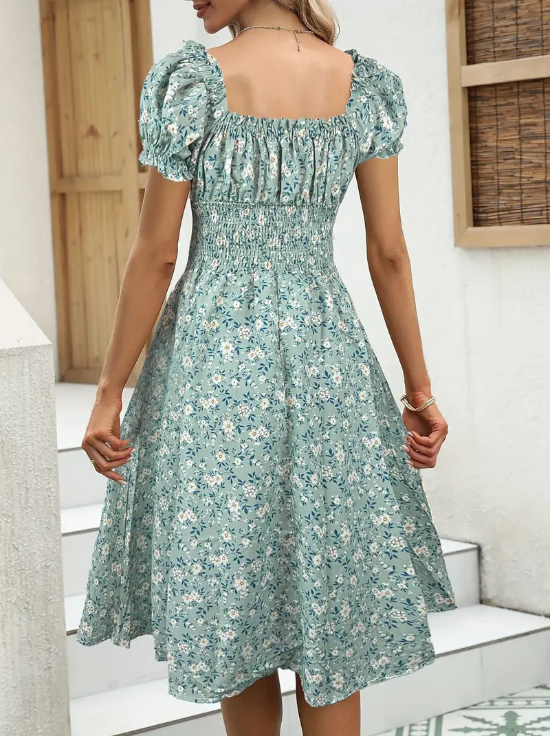 Elegante vestido con cuello en V y mangas abullonadas con estampado floral