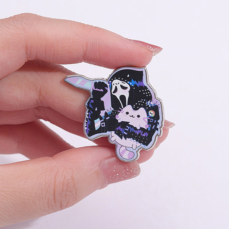 Broche en forme de chaton tenant un fantôme de dessin animé pour Halloween