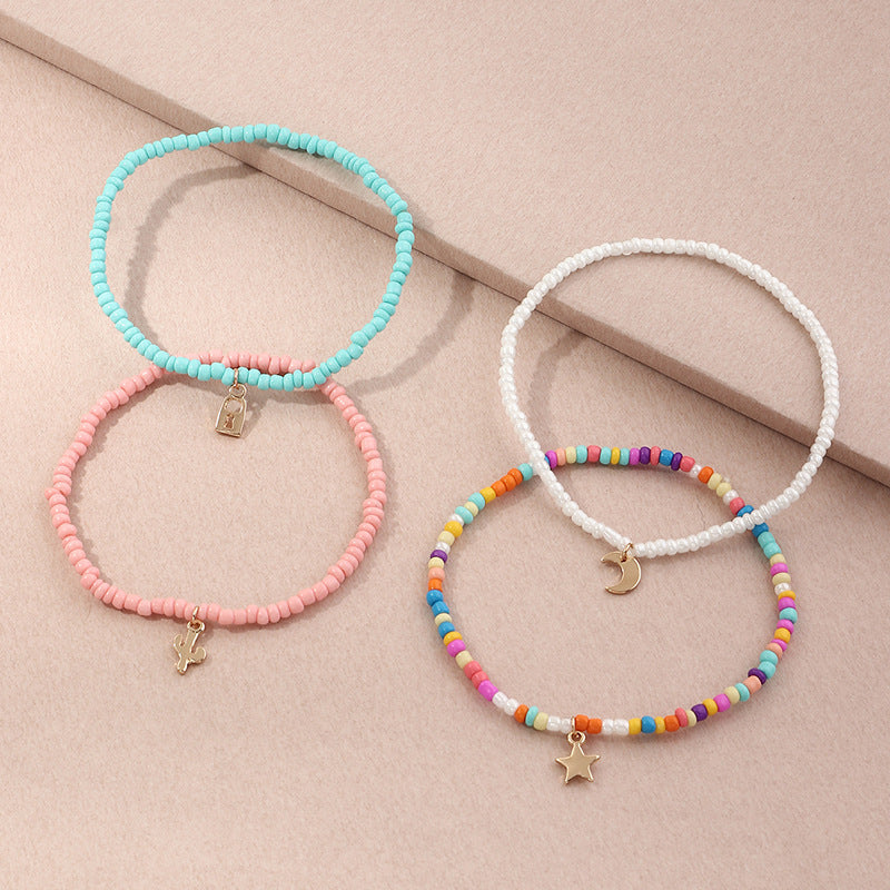 Conjunto de tobillera con cuentas multicolores bohemias y estrella creciente
