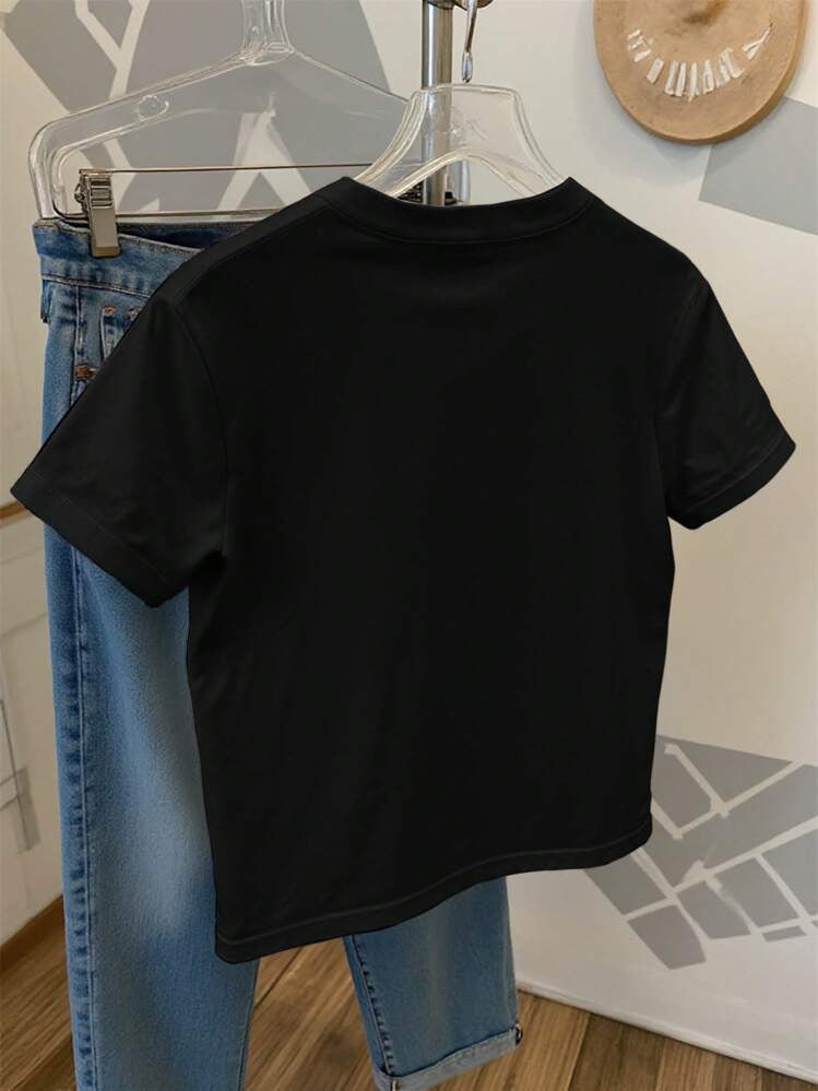Camiseta informal holgada de cuello redondo con estampado de lazo para mujer de verano
