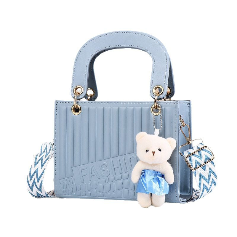 Sac à main décontracté à motif losange de couleur unie pour femme avec pendentif ours