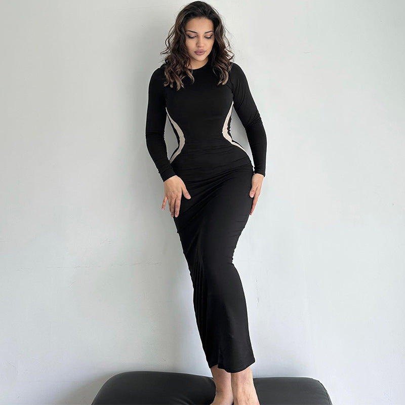 Vestido largo de manga larga con cuello redondo y cintura definida para mujer