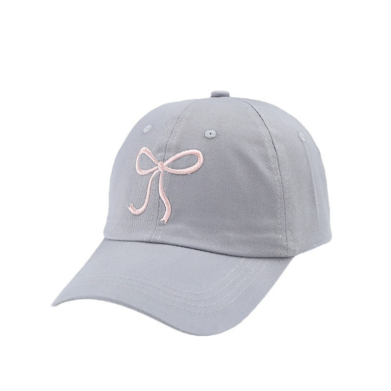 Gorra de béisbol con lazo bordado de color liso para mujer