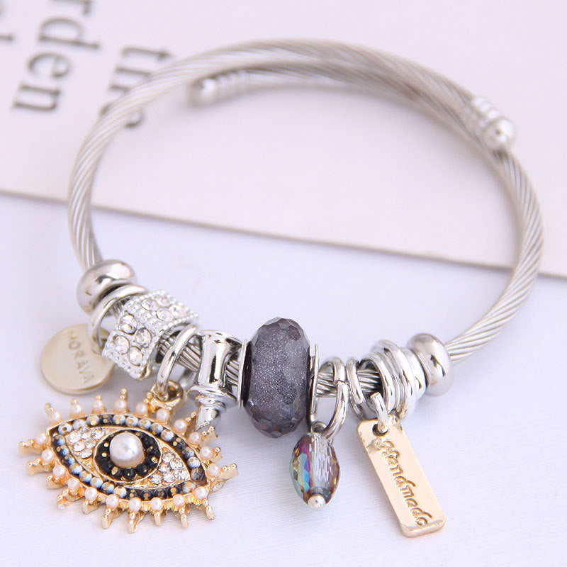 Pulsera de acero inoxidable con diseño vintage de mal de ojo para mujer