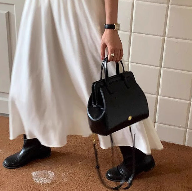 Bolso de mano retro informal de piel encerada negra para mujer
