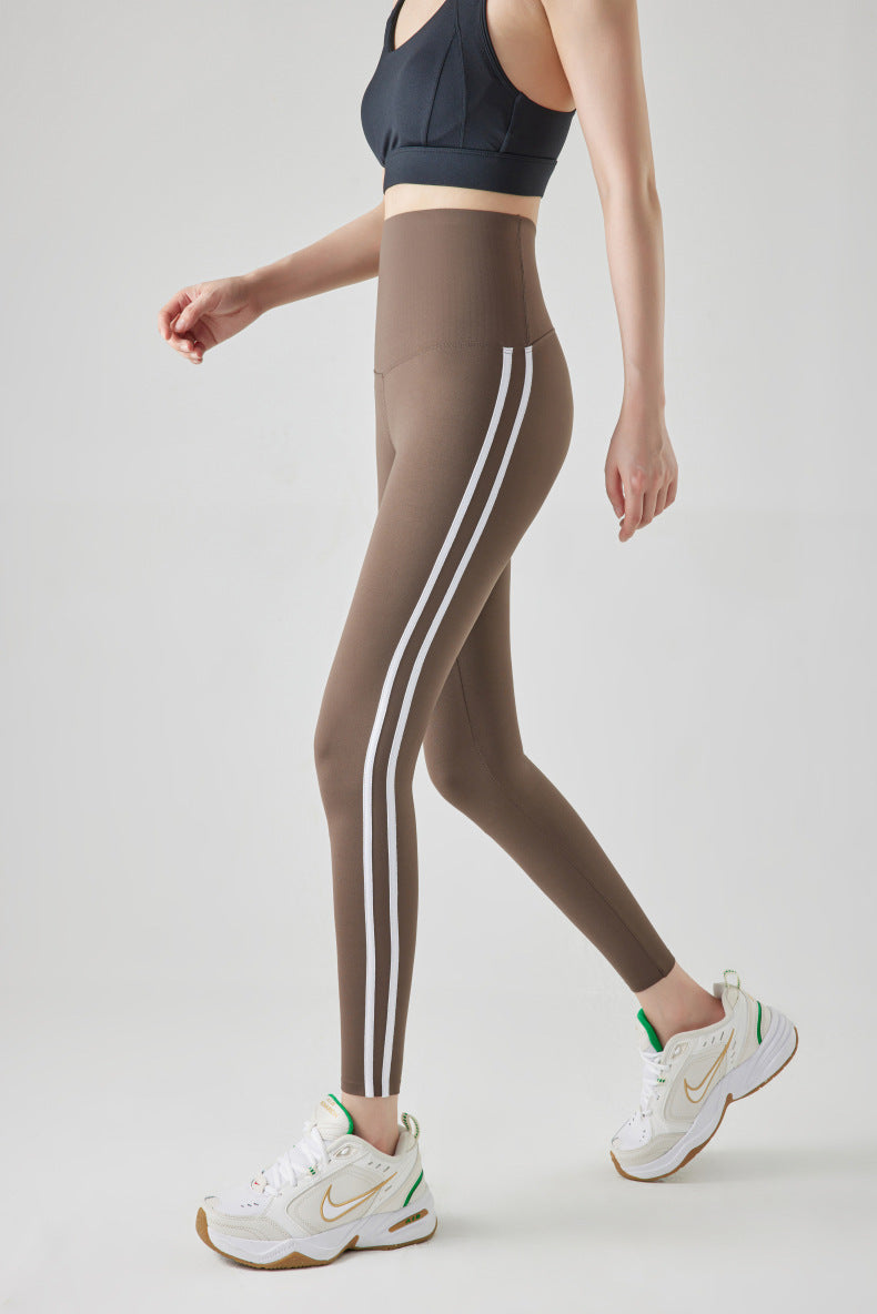 Leggings de sport à rayures et coutures tendance pour femmes