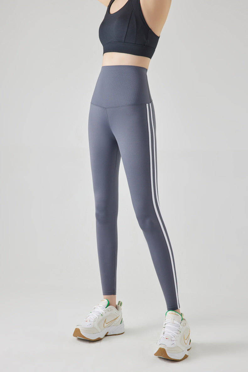 Leggings de sport à rayures et coutures tendance pour femmes