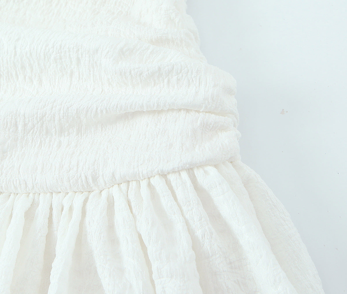 Solid Color Sleeveless Ruffled Hem Mini Dress