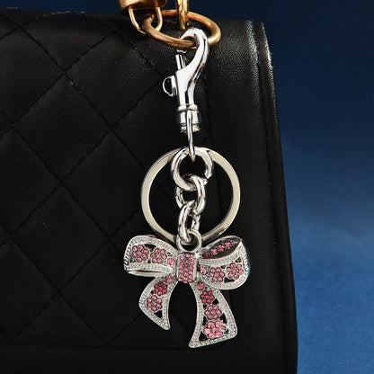 Llavero con colgante de bolso con lazo de diamantes de imitación creativo para mujer