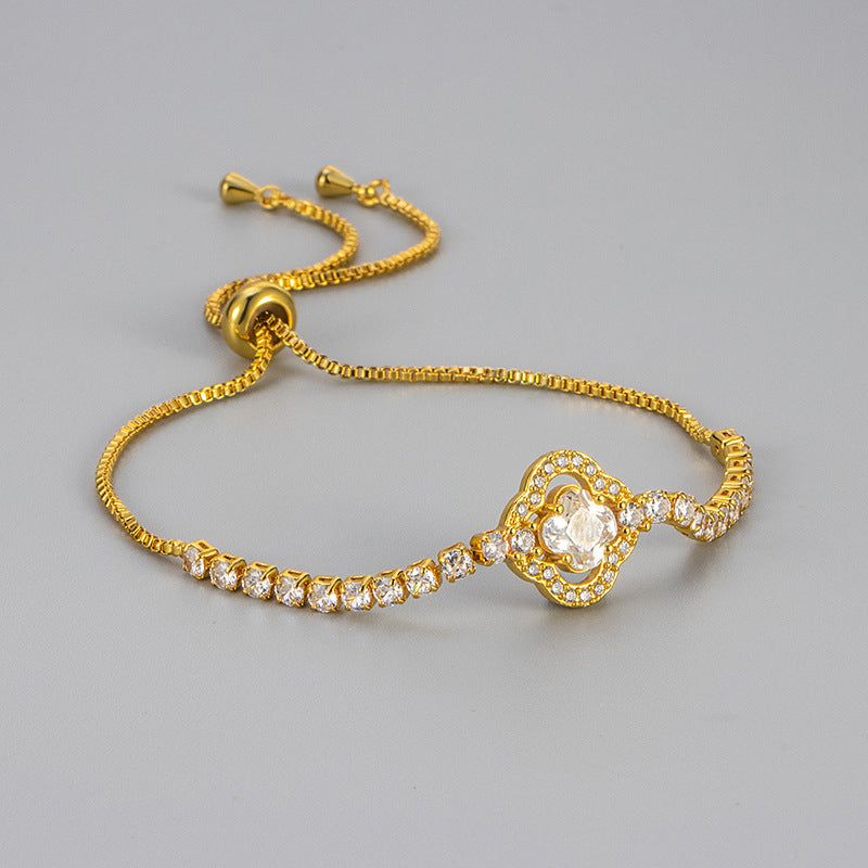 Pulsera de cobre con circonitas y flores de cuatro hojas para mujer