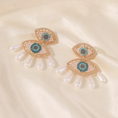 Pendientes de ojo de diablo con perlas de imitación de diamantes de imitación para mujer