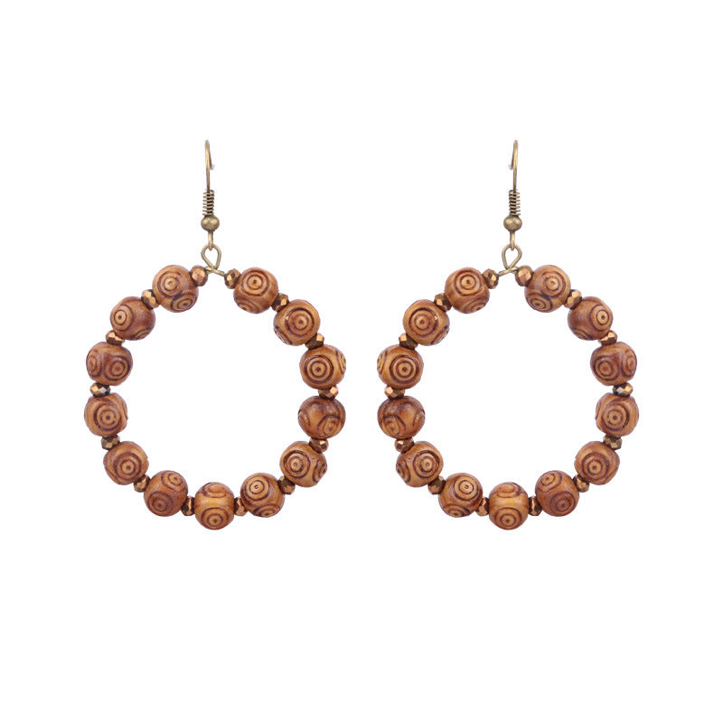 Pendientes de borlas hechos a mano con cuentas de madera bohemias