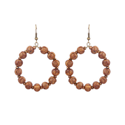 Pendientes de borlas hechos a mano con cuentas de madera bohemias