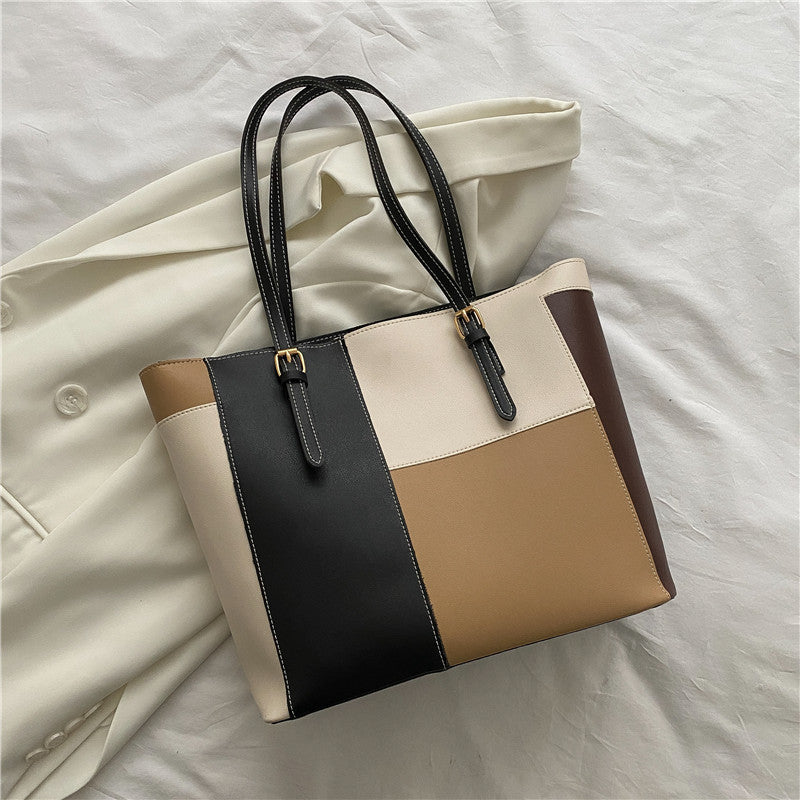 Bolso de mano de gran capacidad con costuras de moda en color
