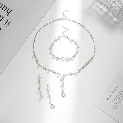 Conjunto de joyas de perlas y diamantes de imitación con temperamento de moda