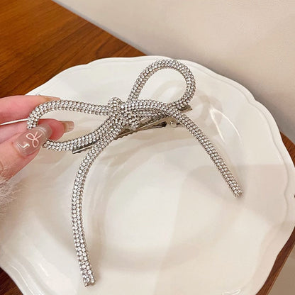 Horquilla con lazo de diamantes de imitación de color liso para mujer - Estilo aleación