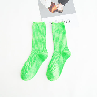 Calcetines de tubo de color liso sencillos a la moda para mujer