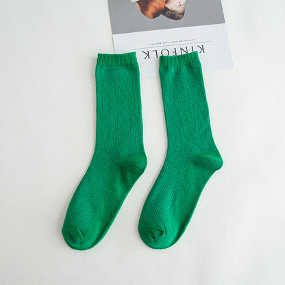 Calcetines de tubo de color liso sencillos a la moda para mujer
