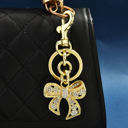 Llavero con colgante de bolso con lazo de diamantes de imitación creativo para mujer