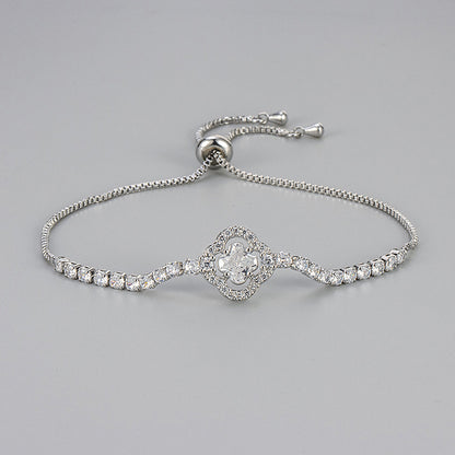 Pulsera de cobre con circonitas y flores de cuatro hojas para mujer