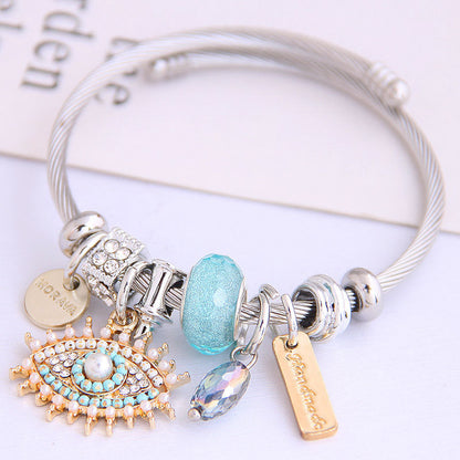 Pulsera de acero inoxidable con diseño vintage de mal de ojo para mujer