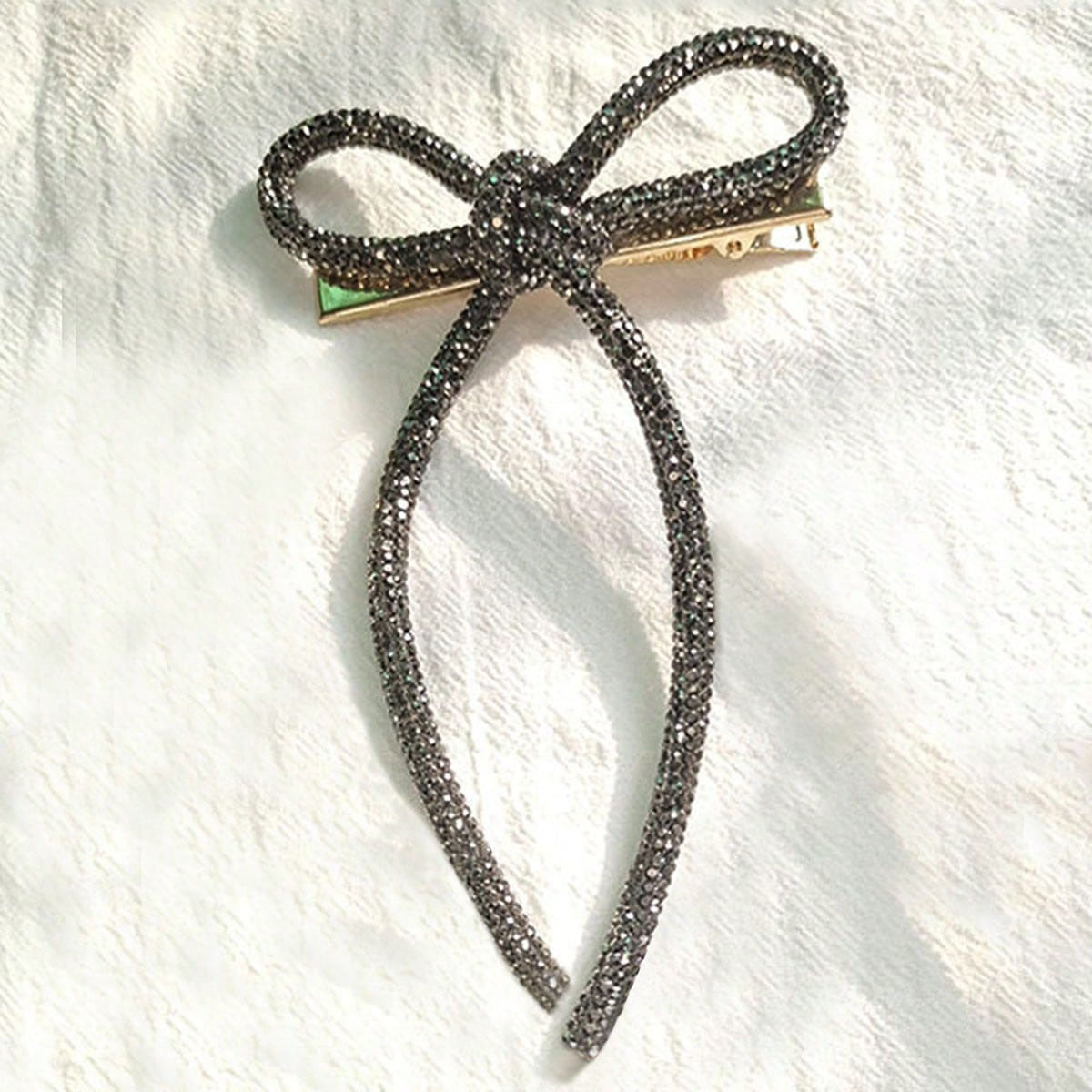 Horquilla con lazo de diamantes de imitación de color liso para mujer - Estilo aleación