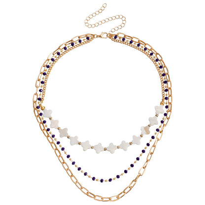 Collar bohemio de minicuentas acrílicas con trébol de cuatro hojas