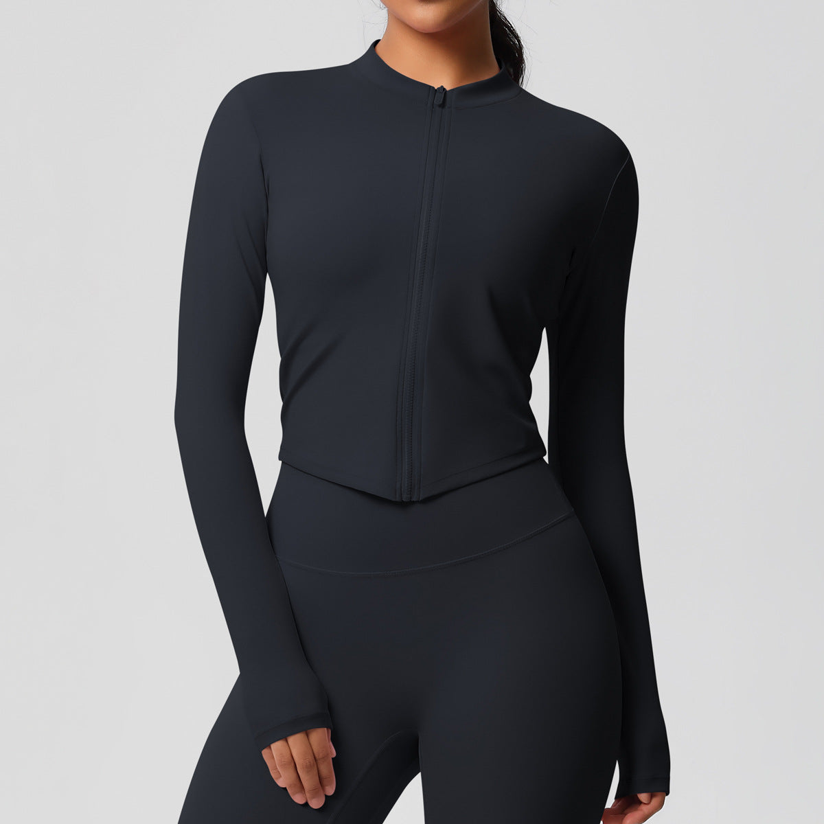 Top deportivo de manga larga de color liso a la moda para mujer