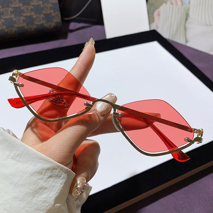 Lunettes de soleil en métal à demi-monture losange pour femmes