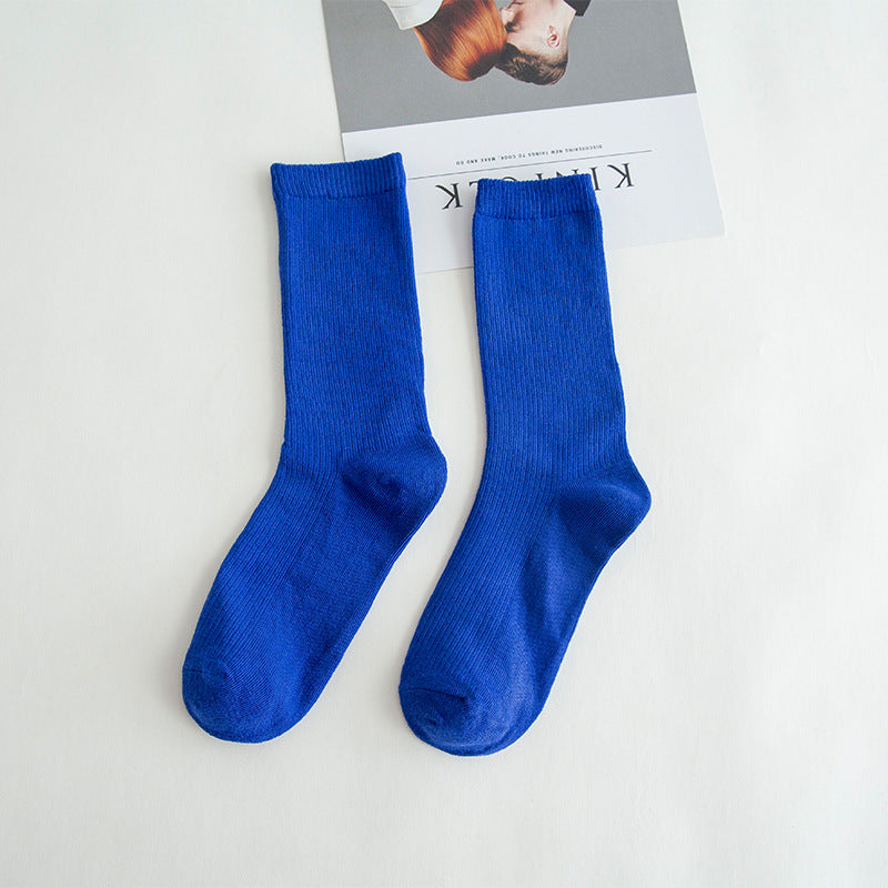 Calcetines de tubo de color liso sencillos a la moda para mujer
