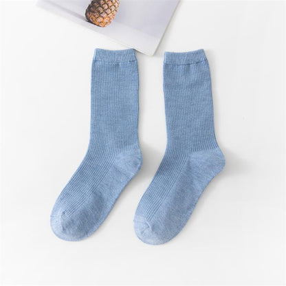 Calcetines de tubo de color liso sencillos a la moda para mujer