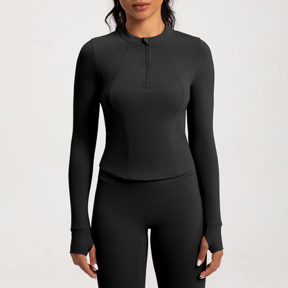 Top de yoga de manga larga con media cremallera de color liso a la moda para mujer