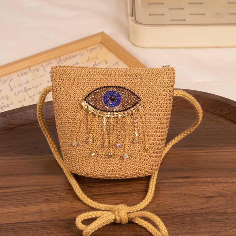 Bolso bandolera informal de paja con diseño de ojo malvado para niñas