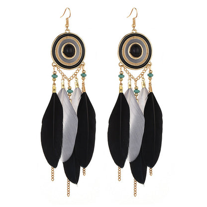 Pendientes bohemios con borlas de plumas exageradas