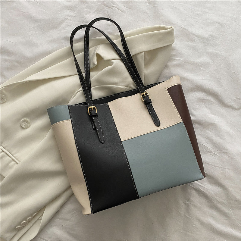 Bolso de mano de gran capacidad con costuras de moda en color