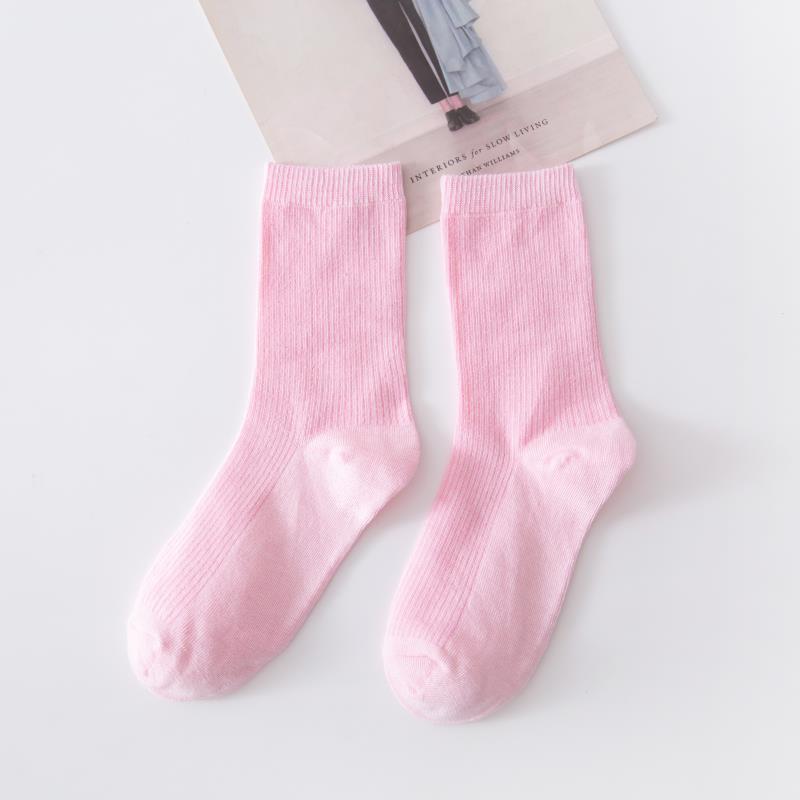 Calcetines de tubo de color liso sencillos a la moda para mujer