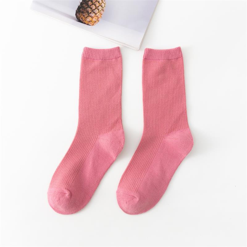 Calcetines de tubo de color liso sencillos a la moda para mujer
