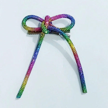 Horquilla con lazo de diamantes de imitación de color liso para mujer - Estilo aleación