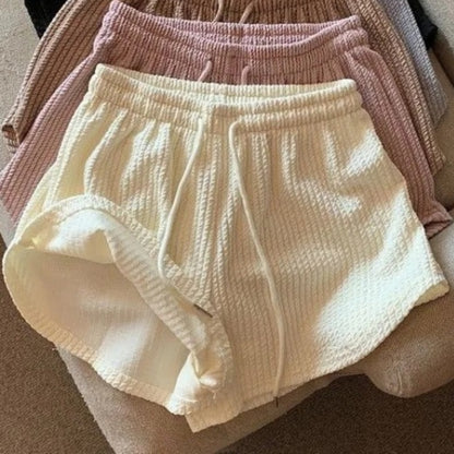 Pantalones cortos holgados de cintura alta con diseño de gofre de color liso a la moda para mujer